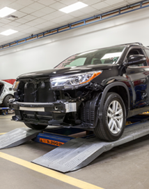 Toyota on vehicle lift | Wilson Toyota of Ames in Ames IA